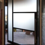 PVD1 Modern Glass Pivot Iron Door